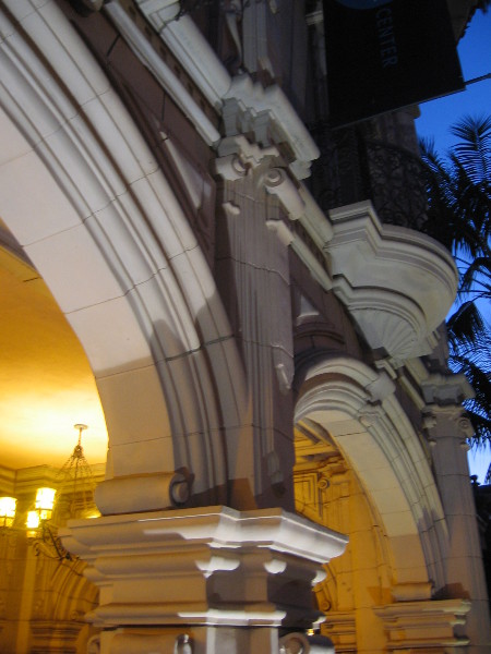 Ornate building facades on El Prado take on new depth at dusk.